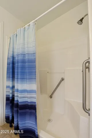 a bathroom with a shower and a tub