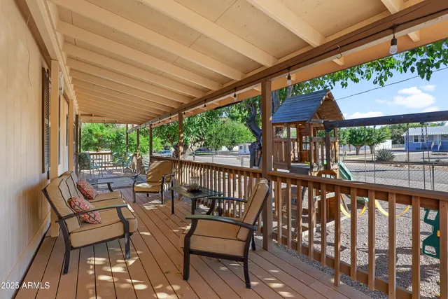 a view of a chair and table in the balcony