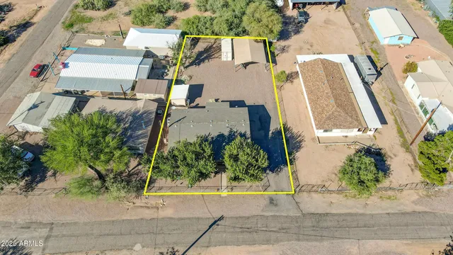 an aerial view of a house with a garden and plants