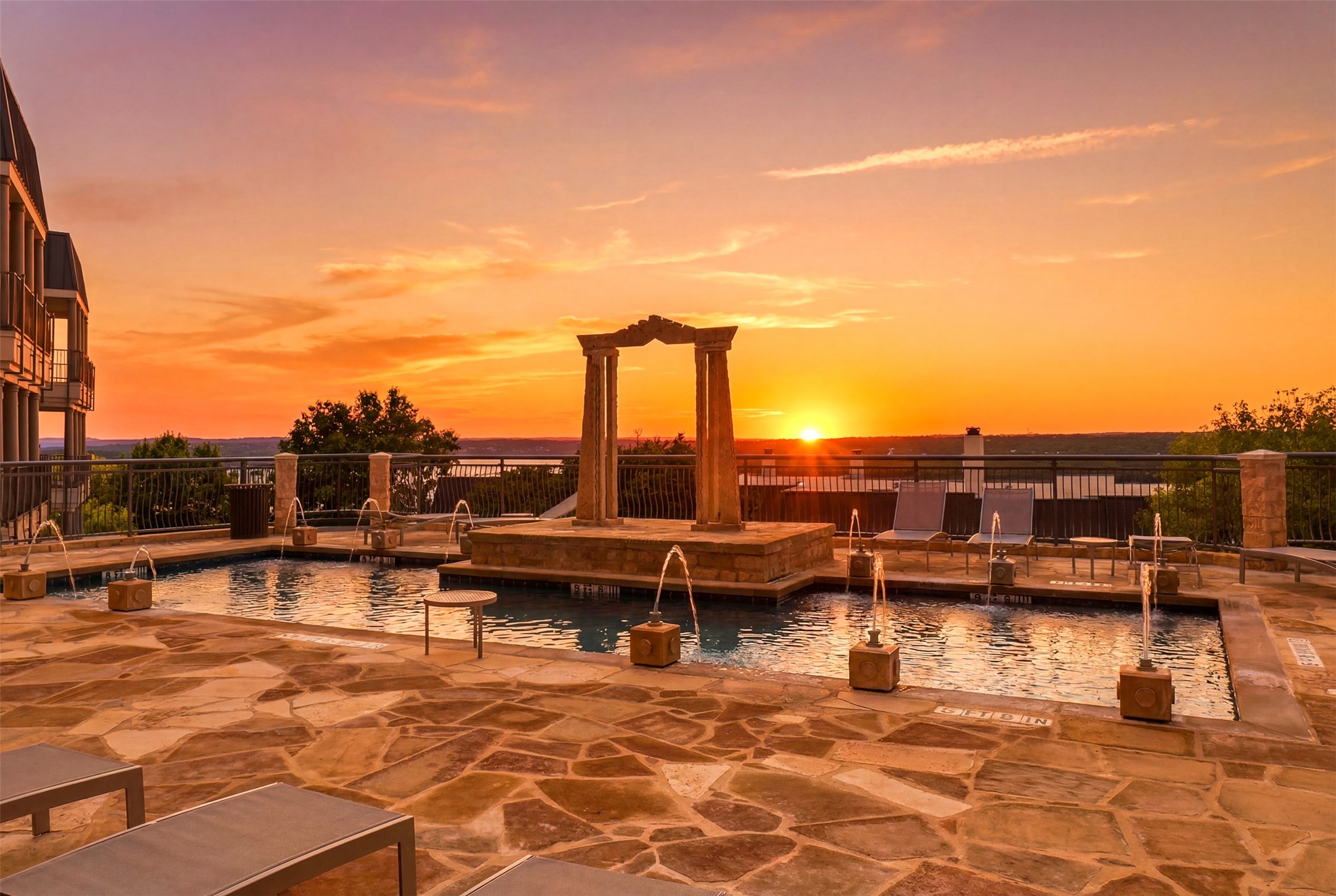 2918 Ranch Road 620, Unit 265 Austin, TX 78734 - Photo 3 of 40 Witness glorious sunsets from this refreshing pool deck with captivating fountain features and breathtaking water views.