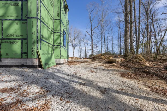 a view of a backyard of the house