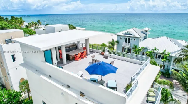 a large kitchen with a table and chairs in it