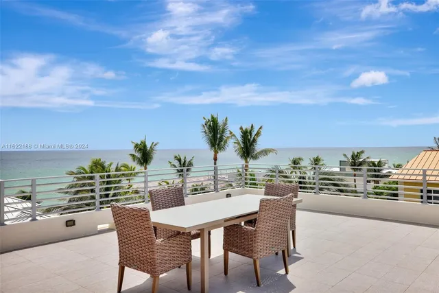a kitchen with white cabinets and a stove
