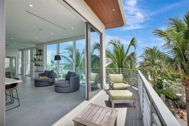 a en suite bathroom with a granite countertop tub sink and mirror