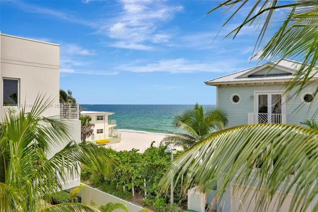 a en suite bathroom with a granite countertop tub sink and mirror