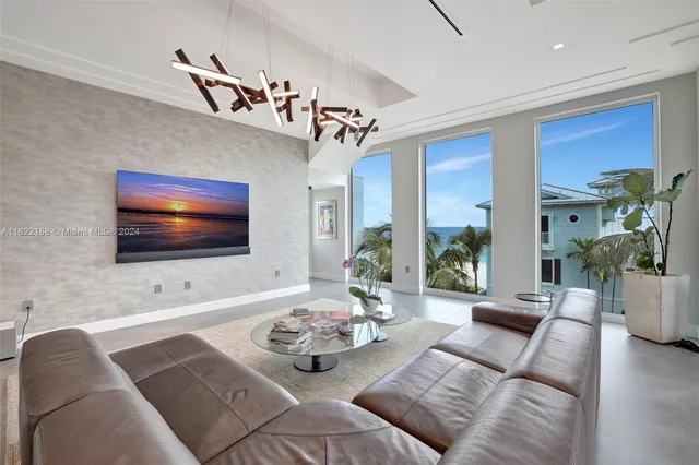 a bedroom with a bed and a flat tv screen on wall