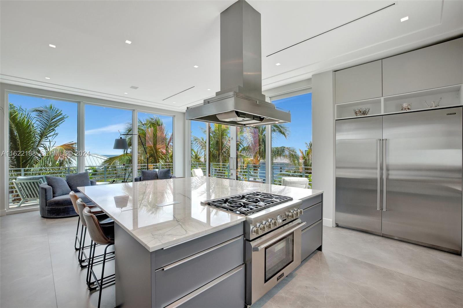 305 Oak Street Hollywood, FL 33019 - Photo 47 of 97 a kitchen with stainless steel appliances granite countertop a sink a stove and a refrigerator