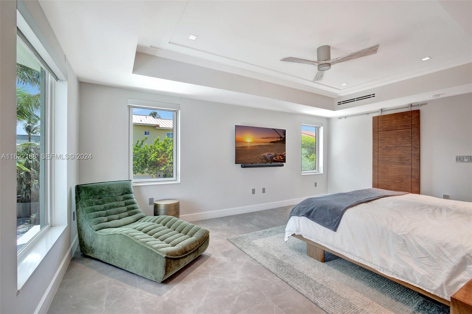 305 Oak Street Hollywood, FL 33019 - Photo 59 of 97 a living room with furniture and a flat screen tv