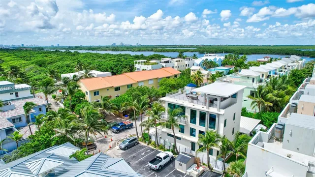 an aerial view of a houses with outdoor space and street view
