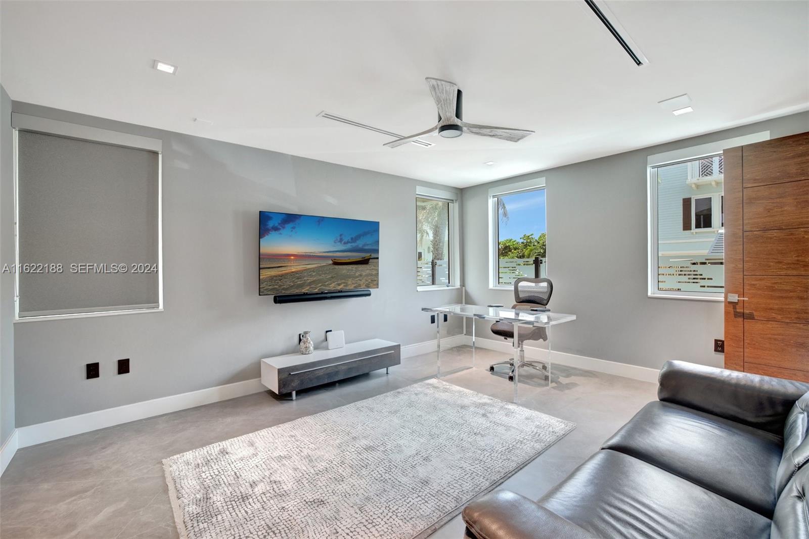 305 Oak Street Hollywood, FL 33019 - Photo 73 of 97 a living room with furniture and a flat screen tv