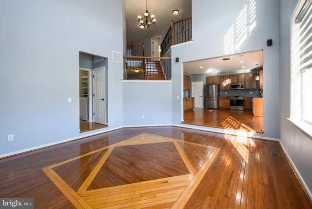 a view of a livingroom with an empty space and a fireplace