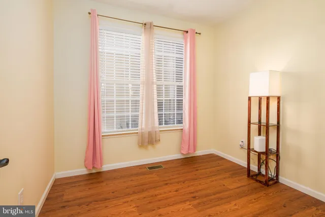 a kitchen with a stove and white cabinets