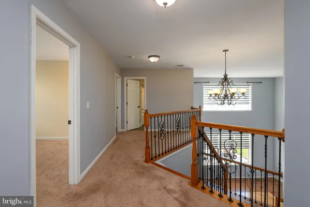a bathroom with a toilet sink vanity tub and shower