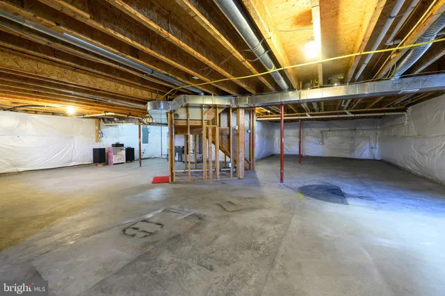 a view of empty room with wooden walls