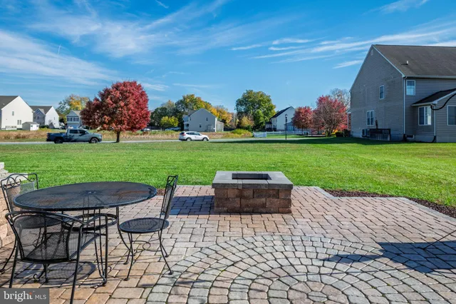 a large kitchen with stainless steel appliances granite countertop wooden floors and granite counter tops