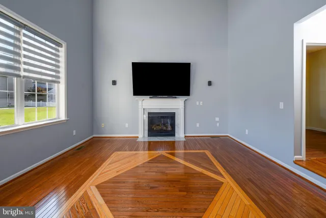 a view of empty room with a flat screen tv
