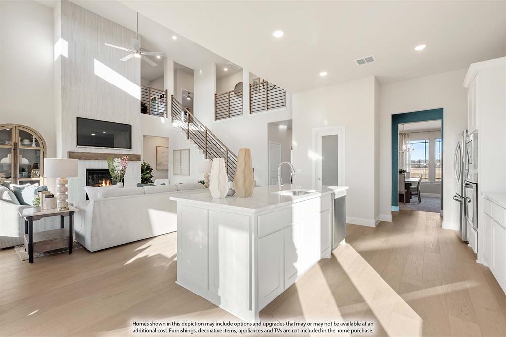 3825 Eagles Bluff Road Midlothian, TX 76065 - Photo 11 of 34 a large white kitchen with lots of counter space a sink and a large window