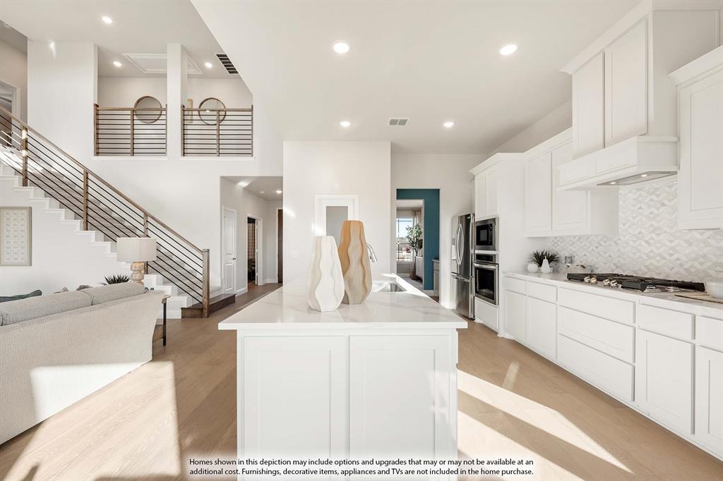 3825 Eagles Bluff Road Midlothian, TX 76065 - Photo 13 of 34 a kitchen with stainless steel appliances kitchen island granite countertop a stove a sink and a refrigerator