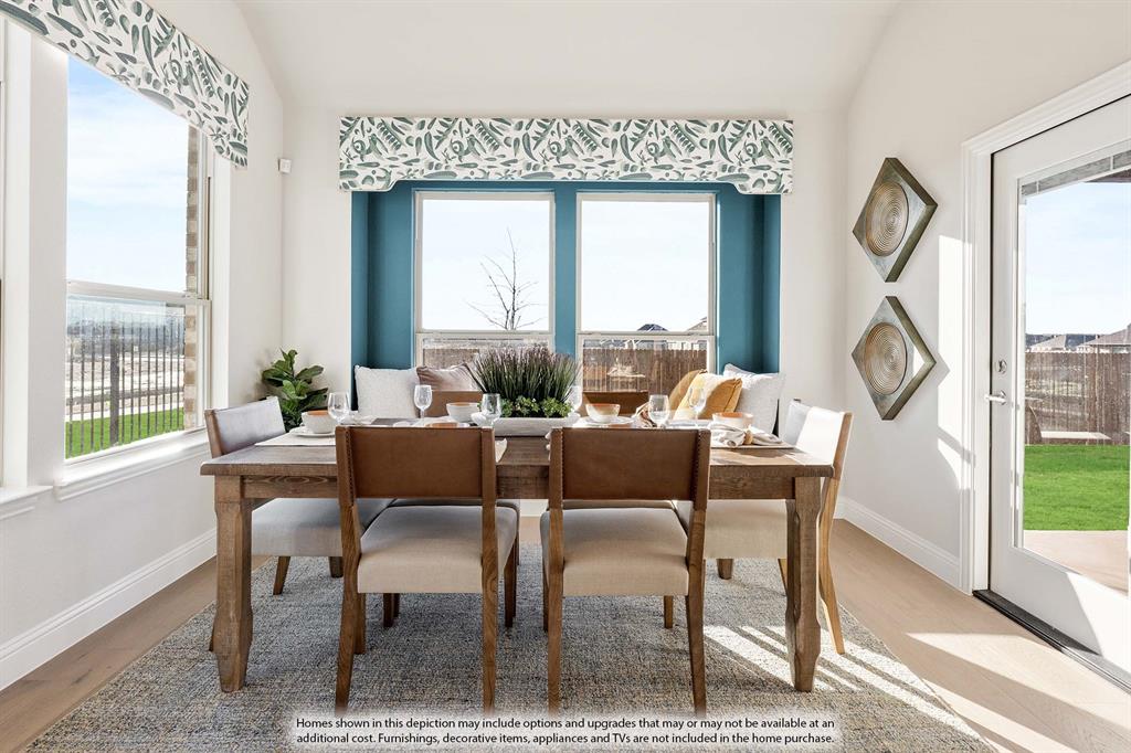 3825 Eagles Bluff Road Midlothian, TX 76065 - Photo 14 of 34 a dining room with furniture and wooden floor