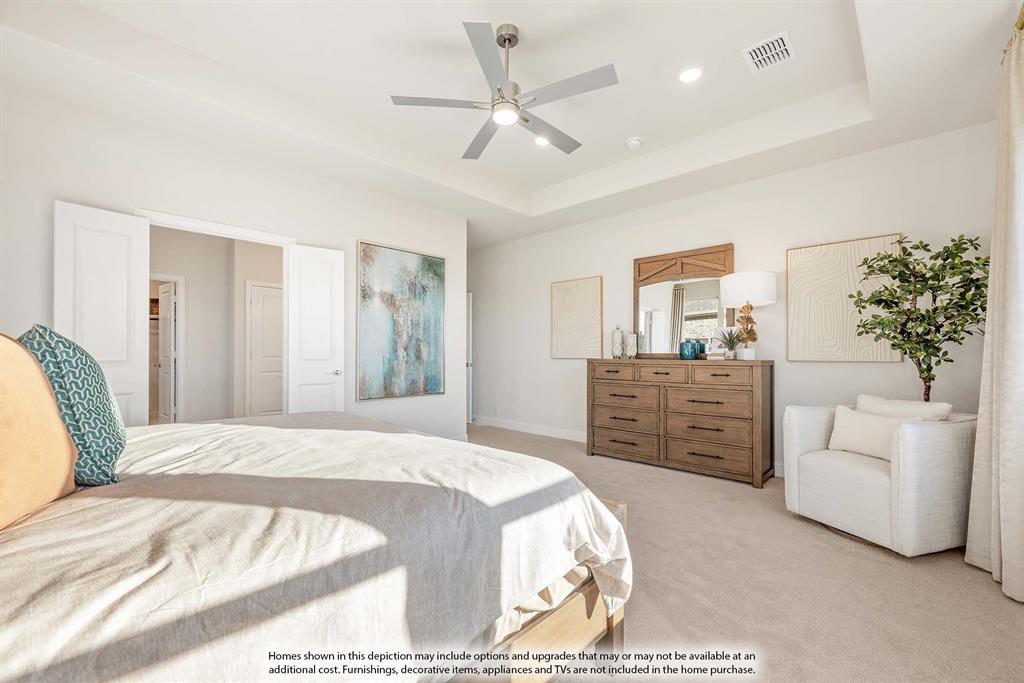 3825 Eagles Bluff Road Midlothian, TX 76065 - Photo 22 of 34 a bedroom with a large bed and a couch