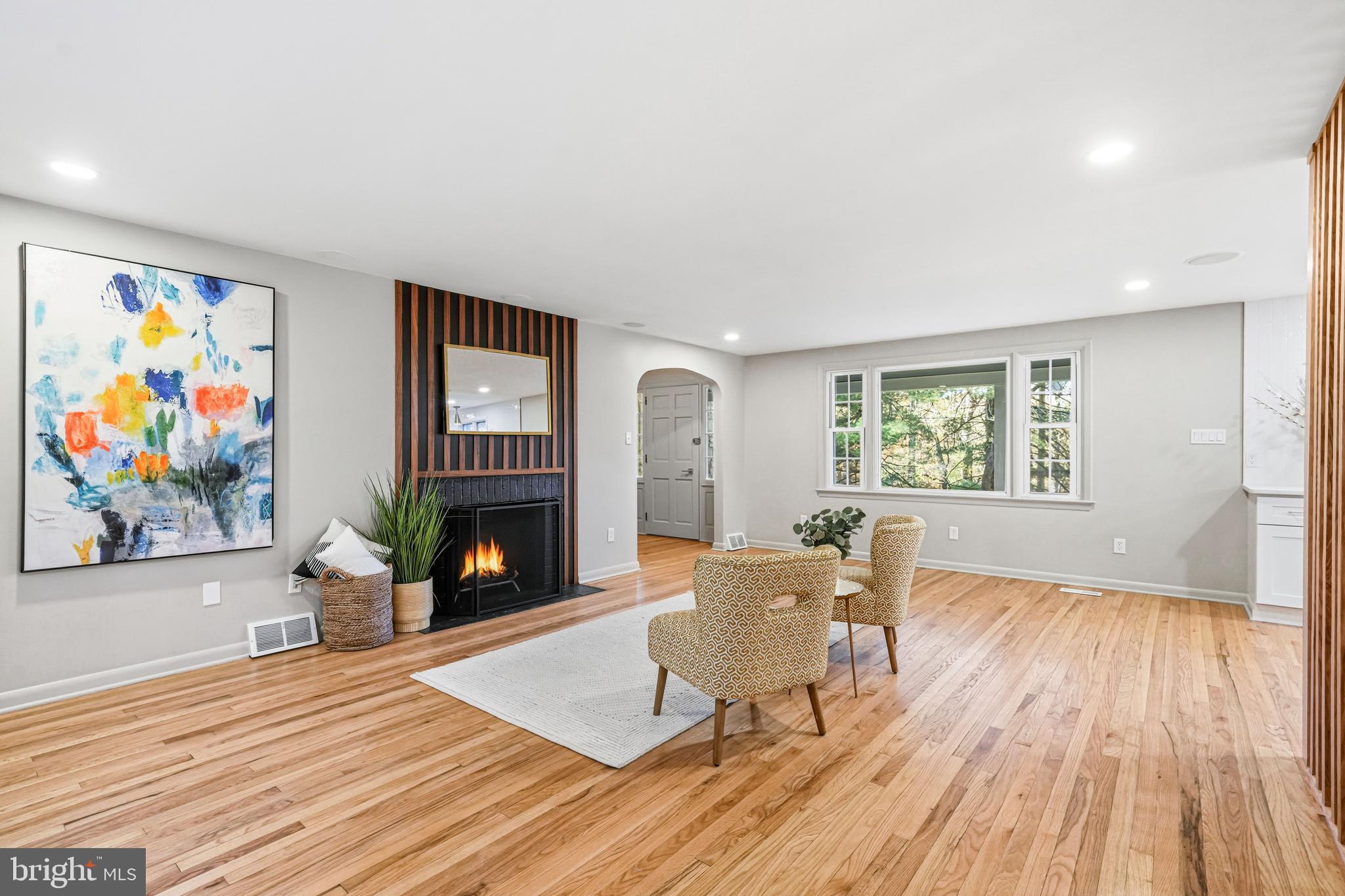 270 Jug Hollow Road Phoenixville, PA 19460 - Photo 13 of 59 a living room with furniture a fireplace and a flat screen tv