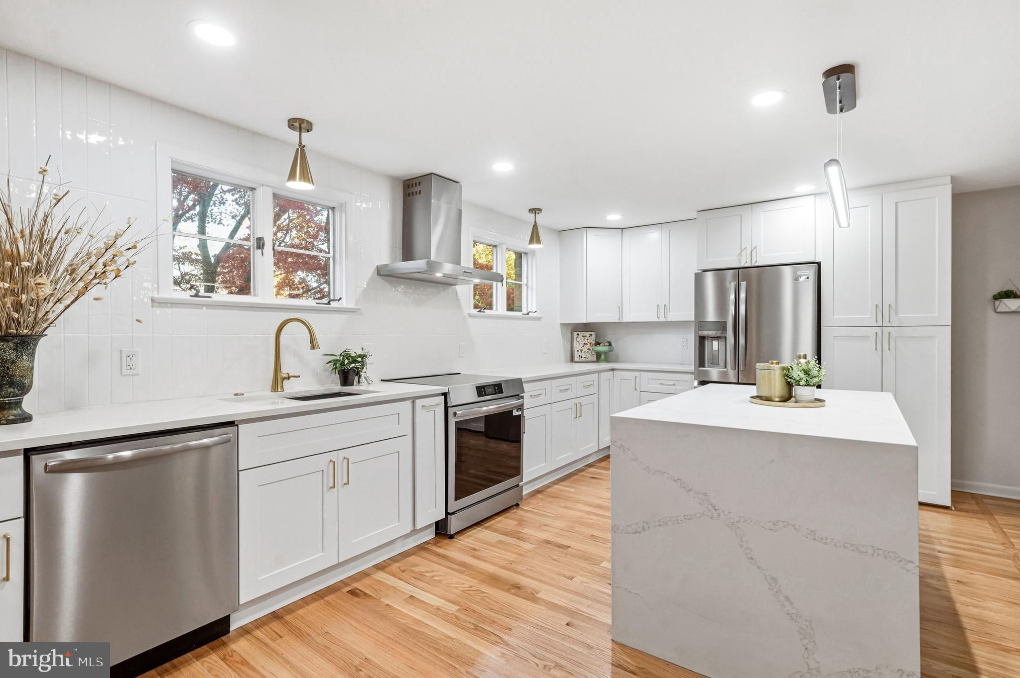 270 Jug Hollow Road Phoenixville, PA 19460 - Photo 14 of 59 a kitchen with stainless steel appliances kitchen island a sink and refrigerator