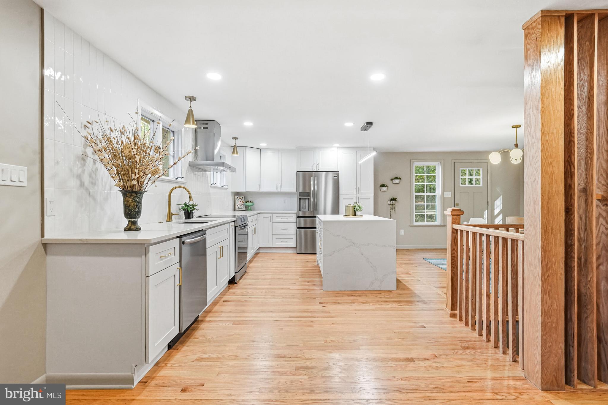 270 Jug Hollow Road Phoenixville, PA 19460 - Photo 15 of 59 a large white kitchen with wooden floor and a sink