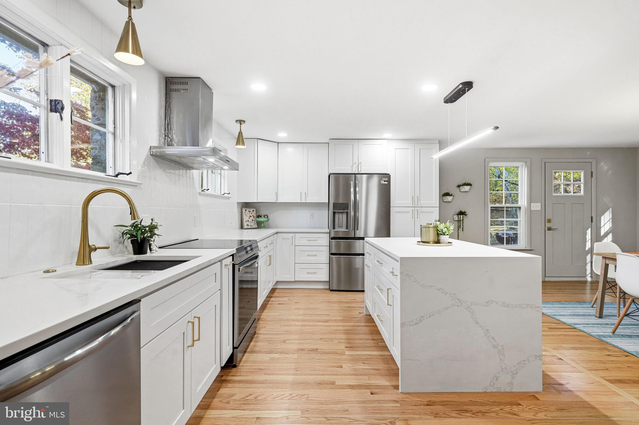 270 Jug Hollow Road Phoenixville, PA 19460 - Photo 16 of 59 a kitchen with stainless steel appliances a sink stove and refrigerator