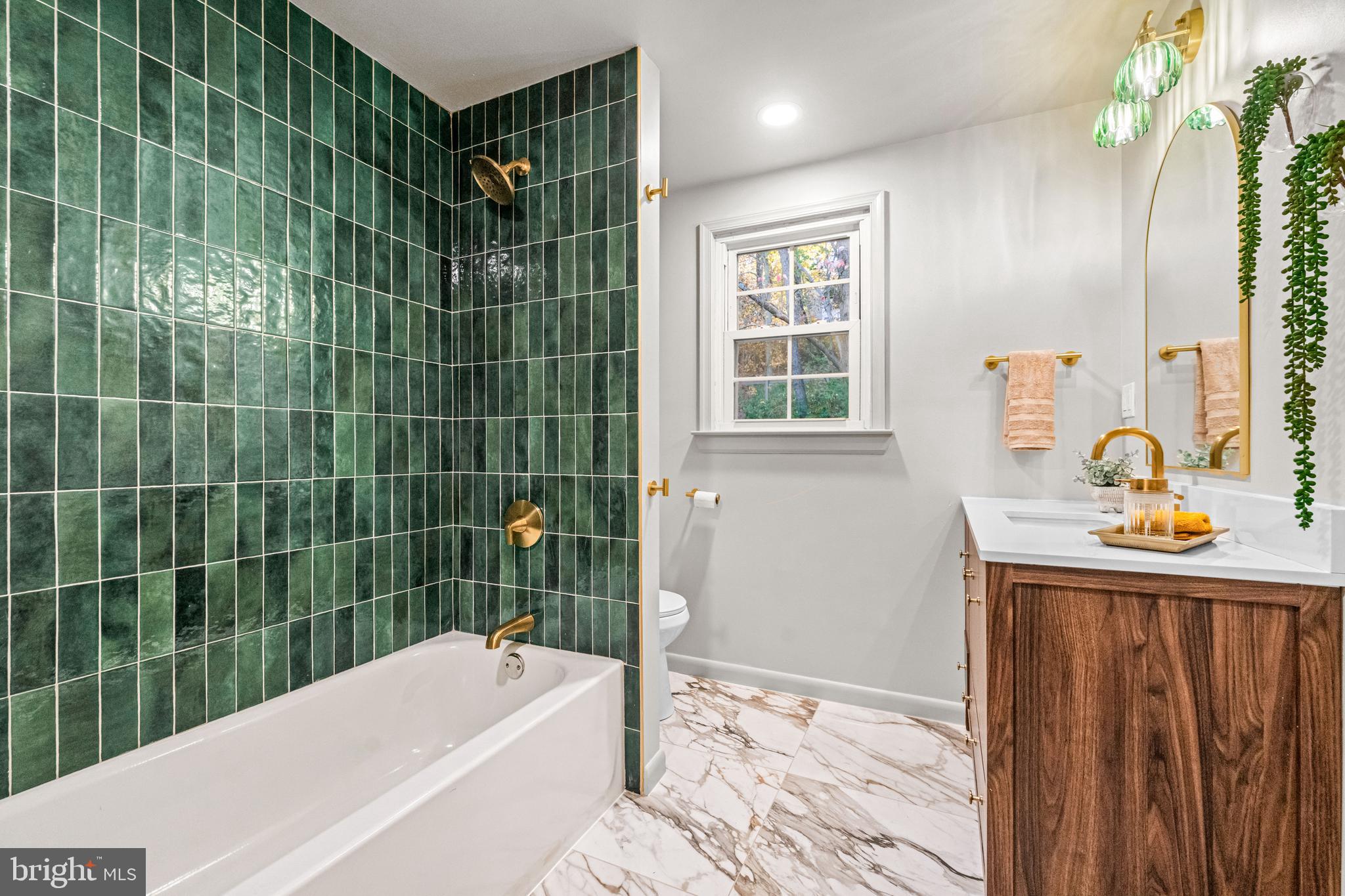 270 Jug Hollow Road Phoenixville, PA 19460 - Photo 35 of 59 a bathroom with a tub sink and window