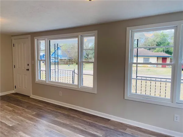 a kitchen with a sink cabinets and window
