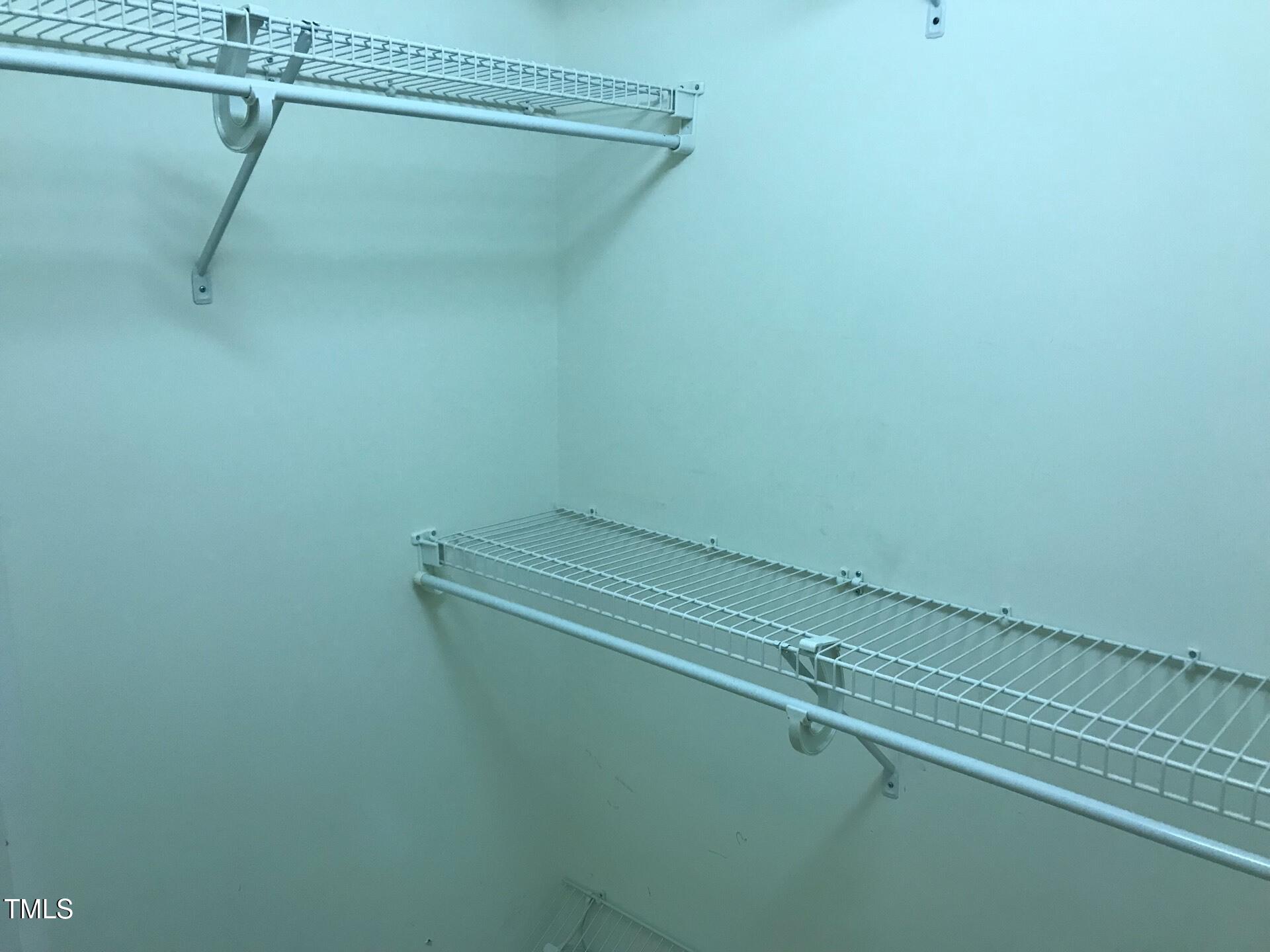 5300 Goldenglow Way Raleigh, NC 27606 - Photo 13 of 24 a view of a room with racks on the wall