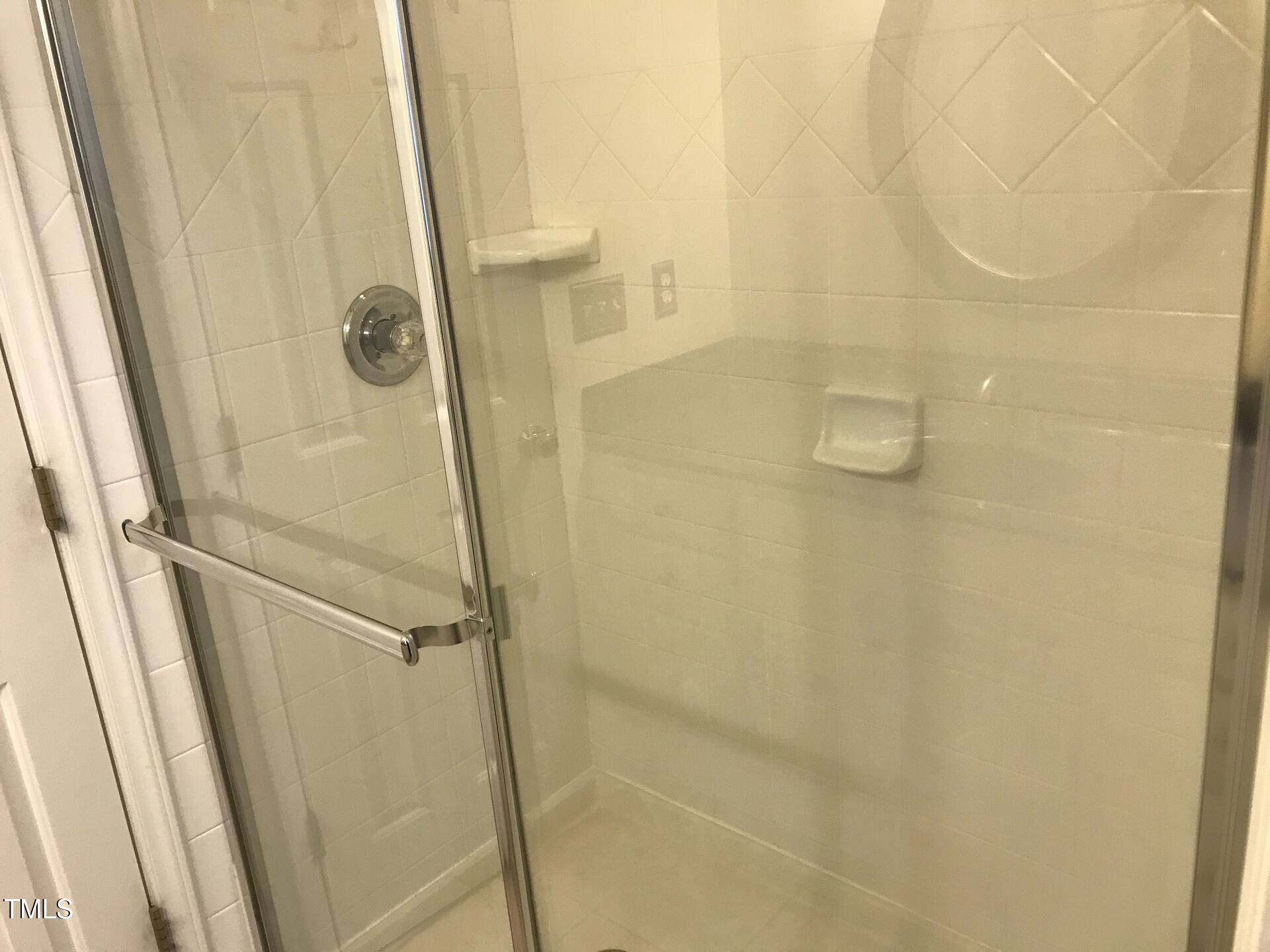 5300 Goldenglow Way Raleigh, NC 27606 - Photo 14 of 24 a bathroom with a shower