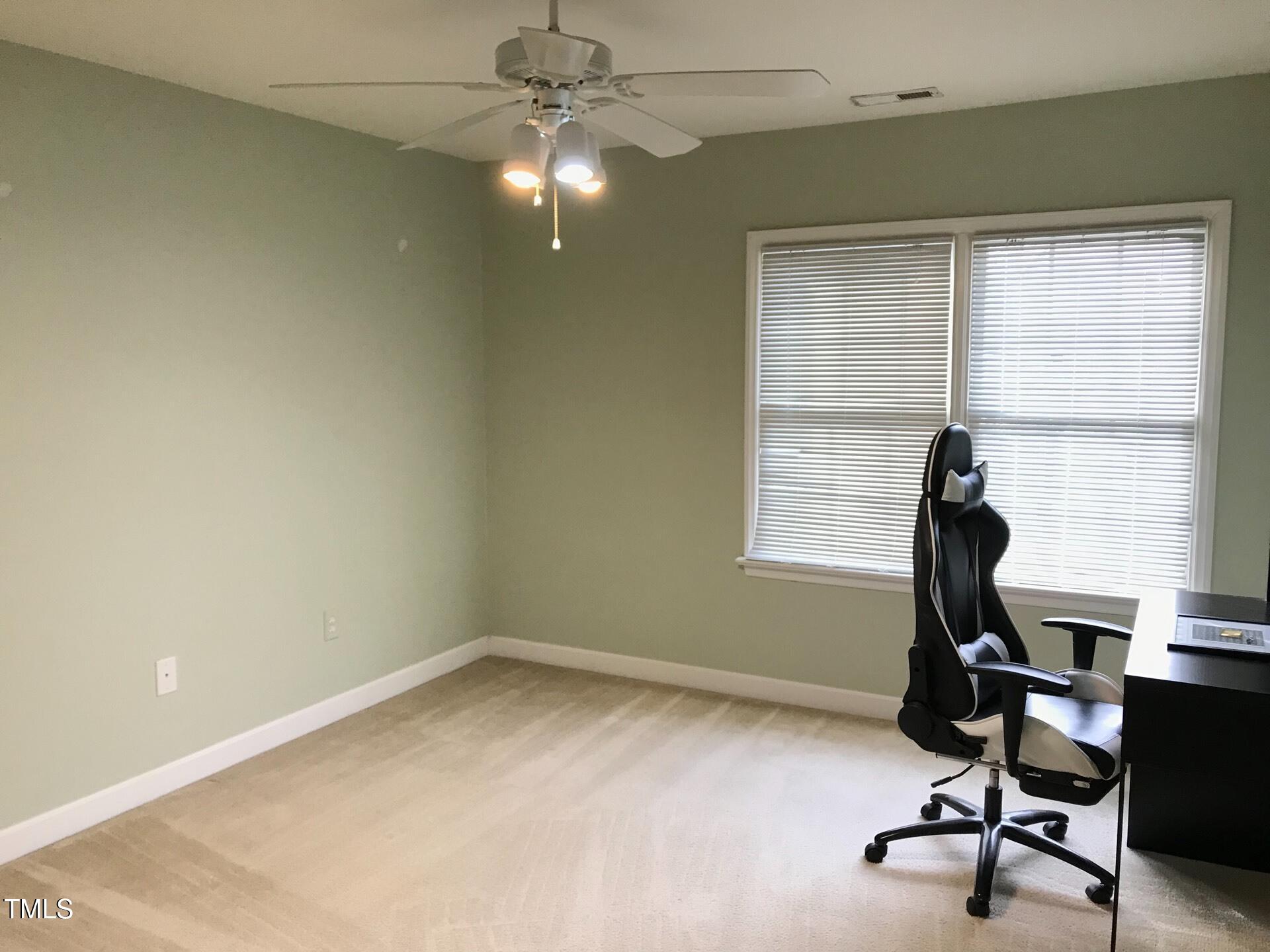 5300 Goldenglow Way Raleigh, NC 27606 - Photo 16 of 24 a view of a workspace with furniture and a window