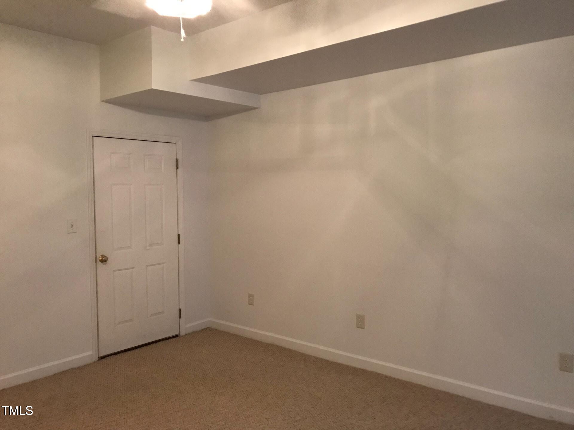 5300 Goldenglow Way Raleigh, NC 27606 - Photo 21 of 24 an empty room with a workbench