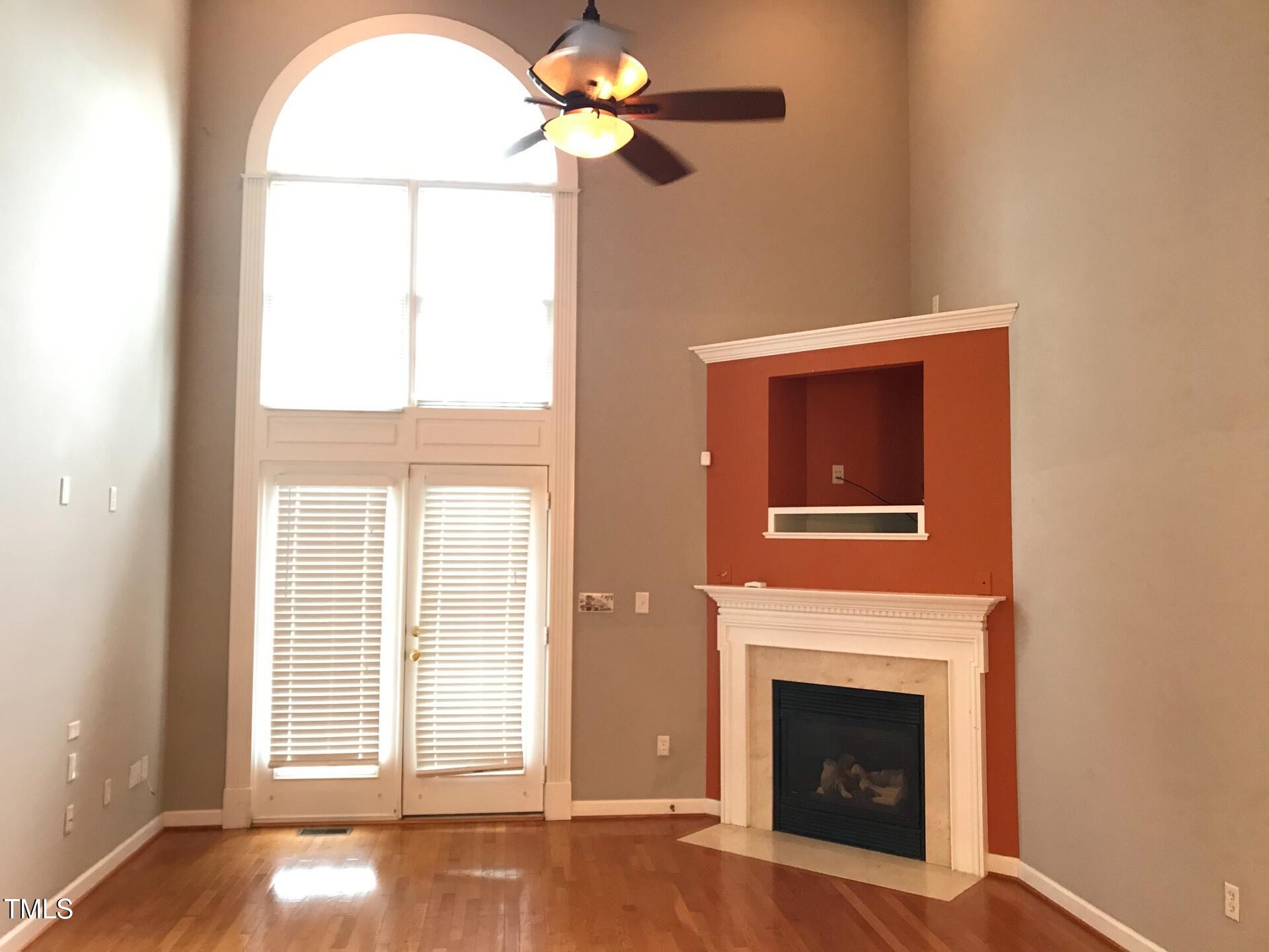 5300 Goldenglow Way Raleigh, NC 27606 - Photo 4 of 24 a view of livingroom with window fireplace