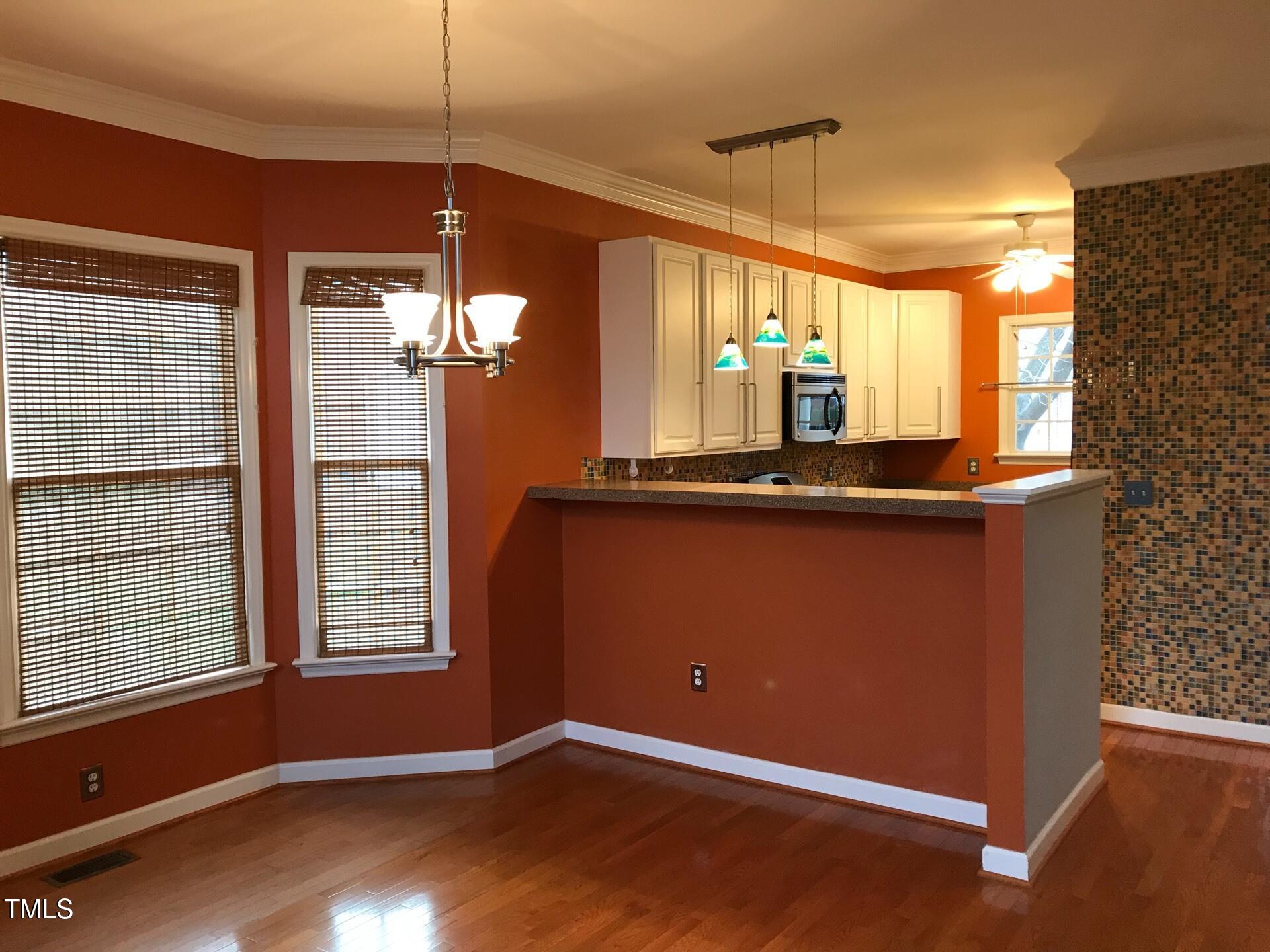 5300 Goldenglow Way Raleigh, NC 27606 - Photo 6 of 24 a view of a kitchen with a sink and window