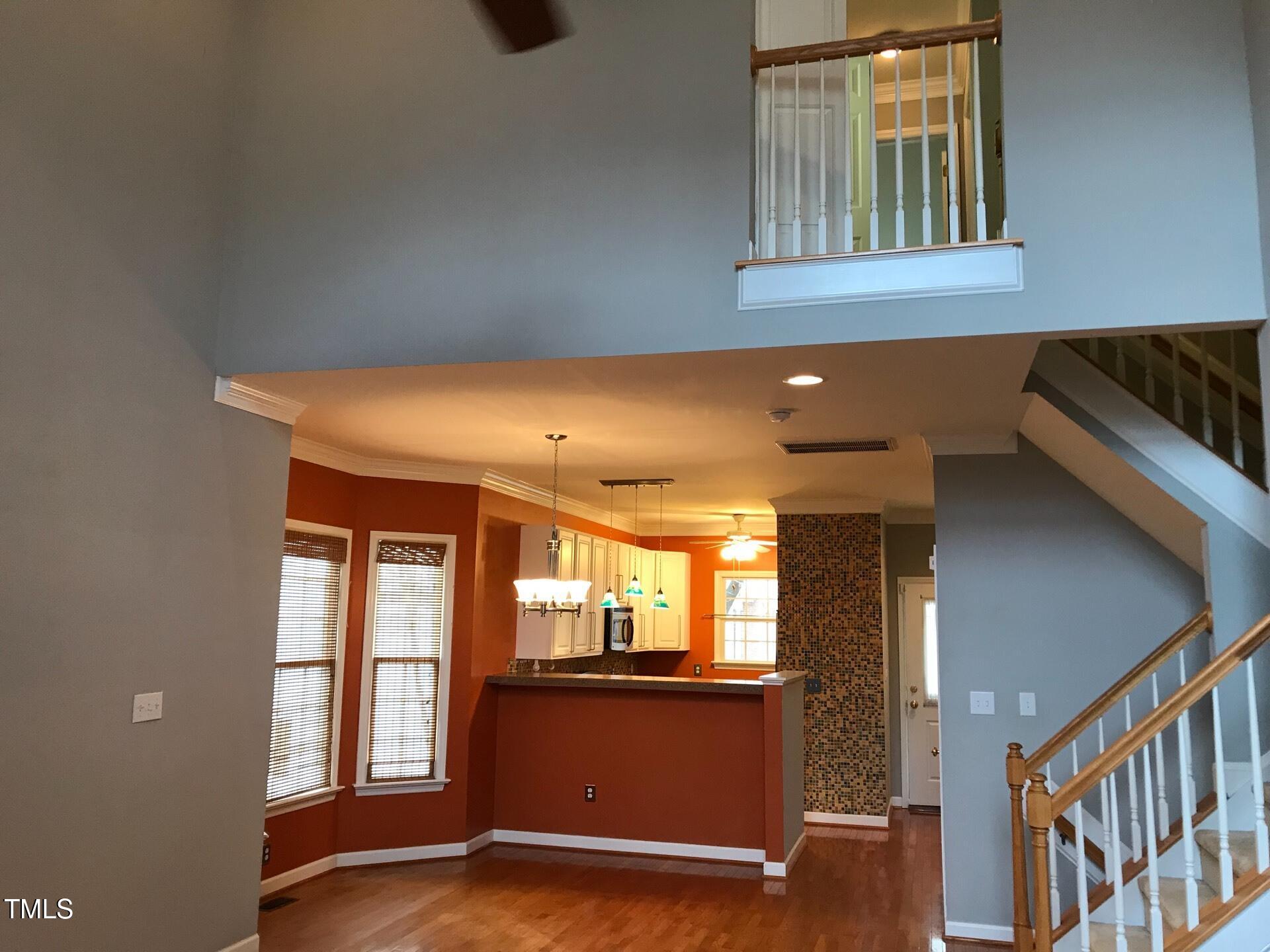 5300 Goldenglow Way Raleigh, NC 27606 - Photo 7 of 24 a view of entryway and hall with wooden floor