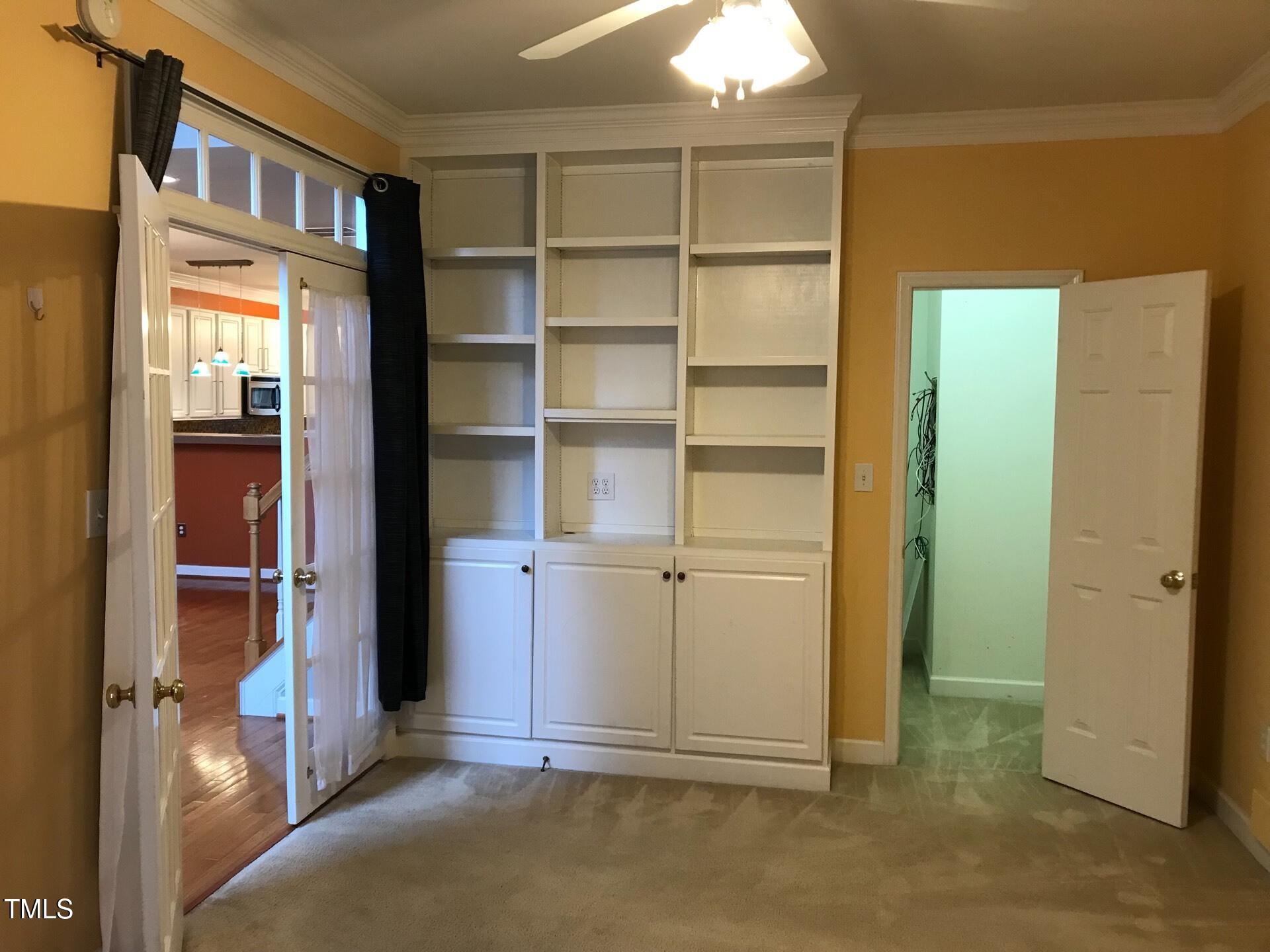 5300 Goldenglow Way Raleigh, NC 27606 - Photo 8 of 24 a view of walk in closet with empty racks
