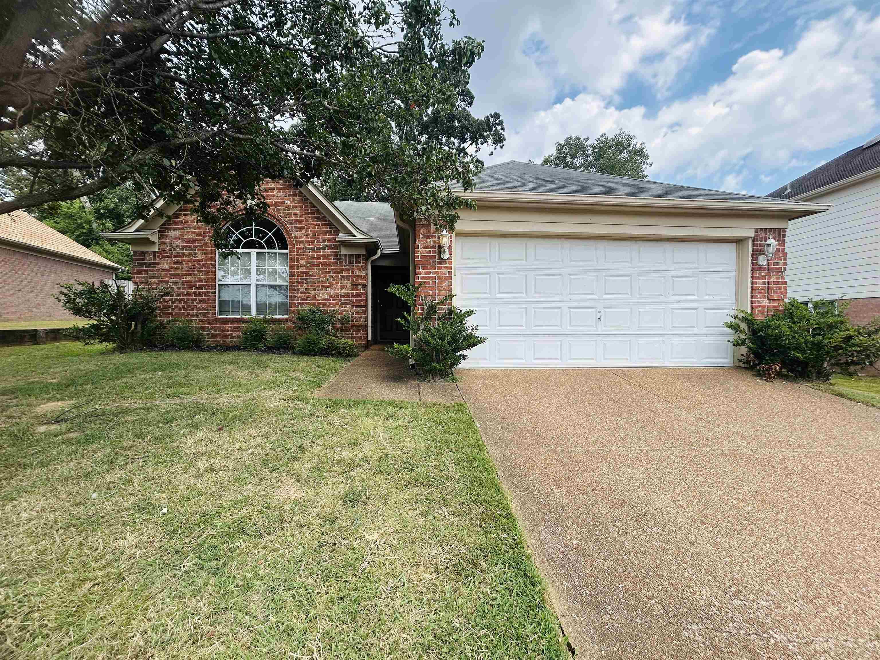 3912 Sundale Way West Memphis, TN 38135 - Photo 1 of 25 a front view of a house with a yard and garage