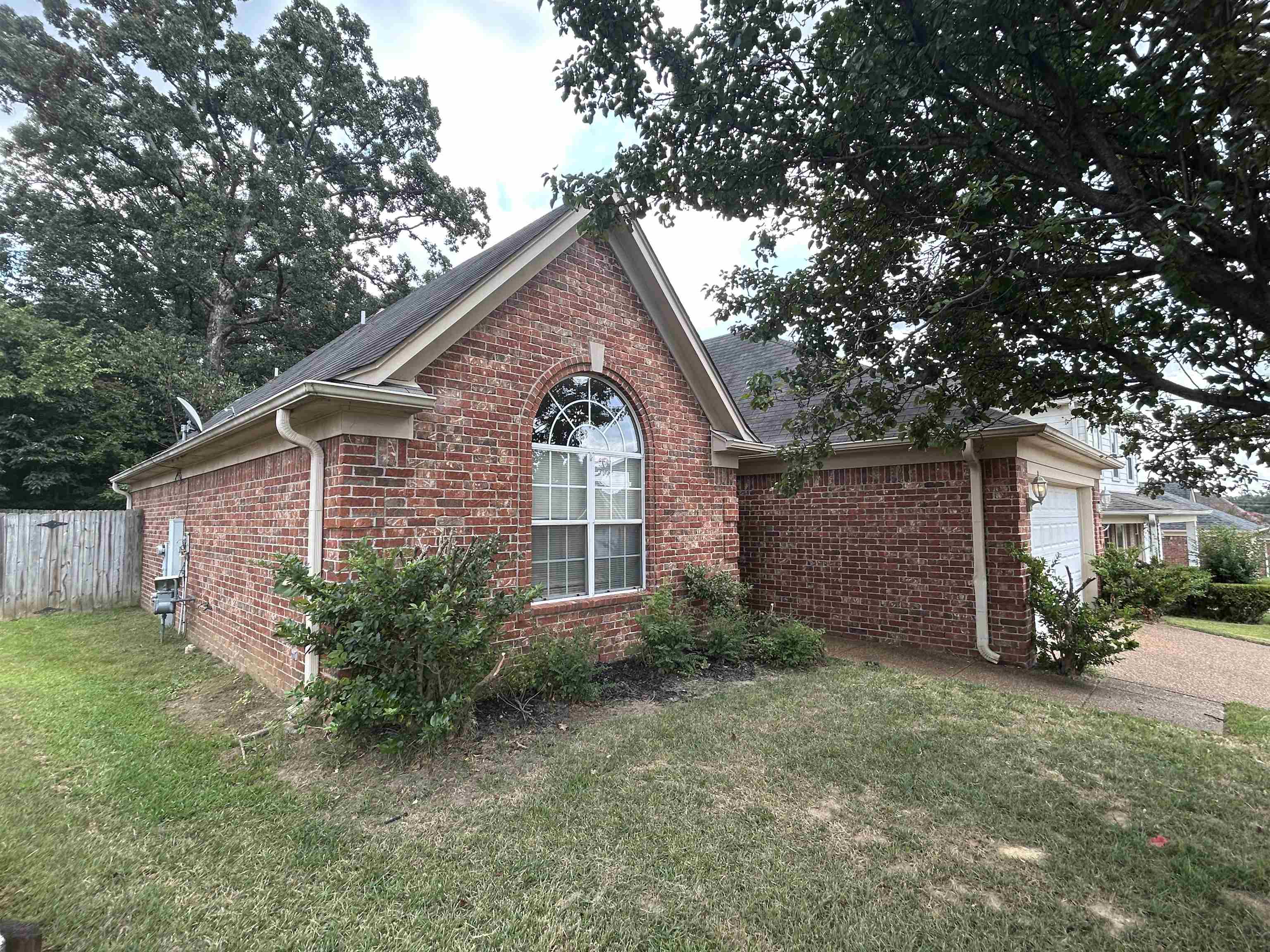 3912 Sundale Way West Memphis, TN 38135 - Photo 2 of 25 a front view of a house with garden