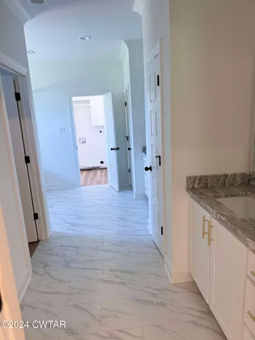 wooden floor with a kitchen