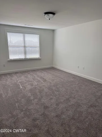 a bathroom with a granite countertop toilet a sink and bathtub