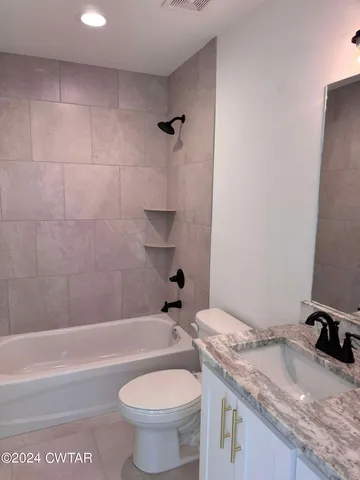 a view of an empty room and a window