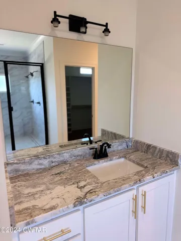 a view of a bathroom sink and a mirror