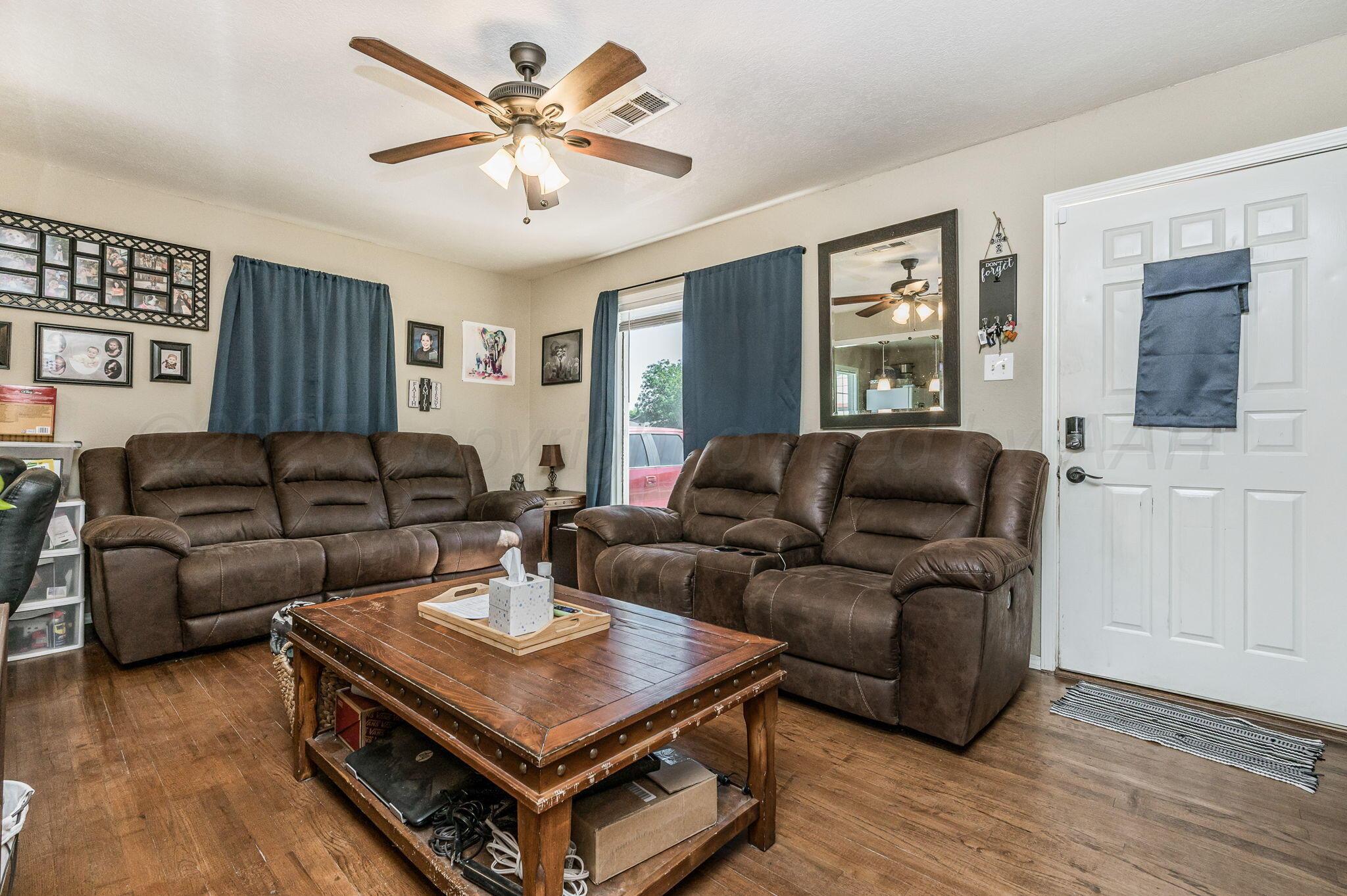 4114 South Hayden Street Amarillo, TX 79110 - Photo 3 of 18 a living room with furniture and a window