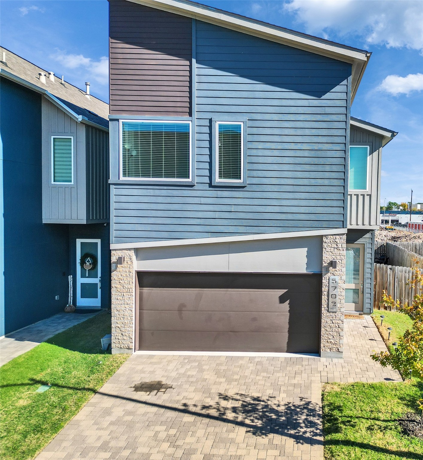 a front view of a house with yard
