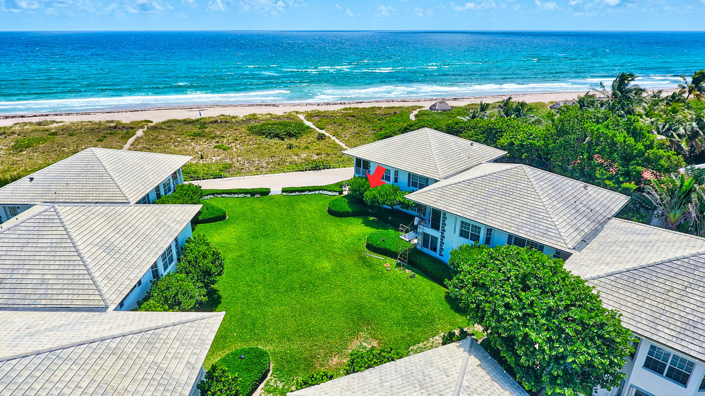 an aerial view of a house with a garden