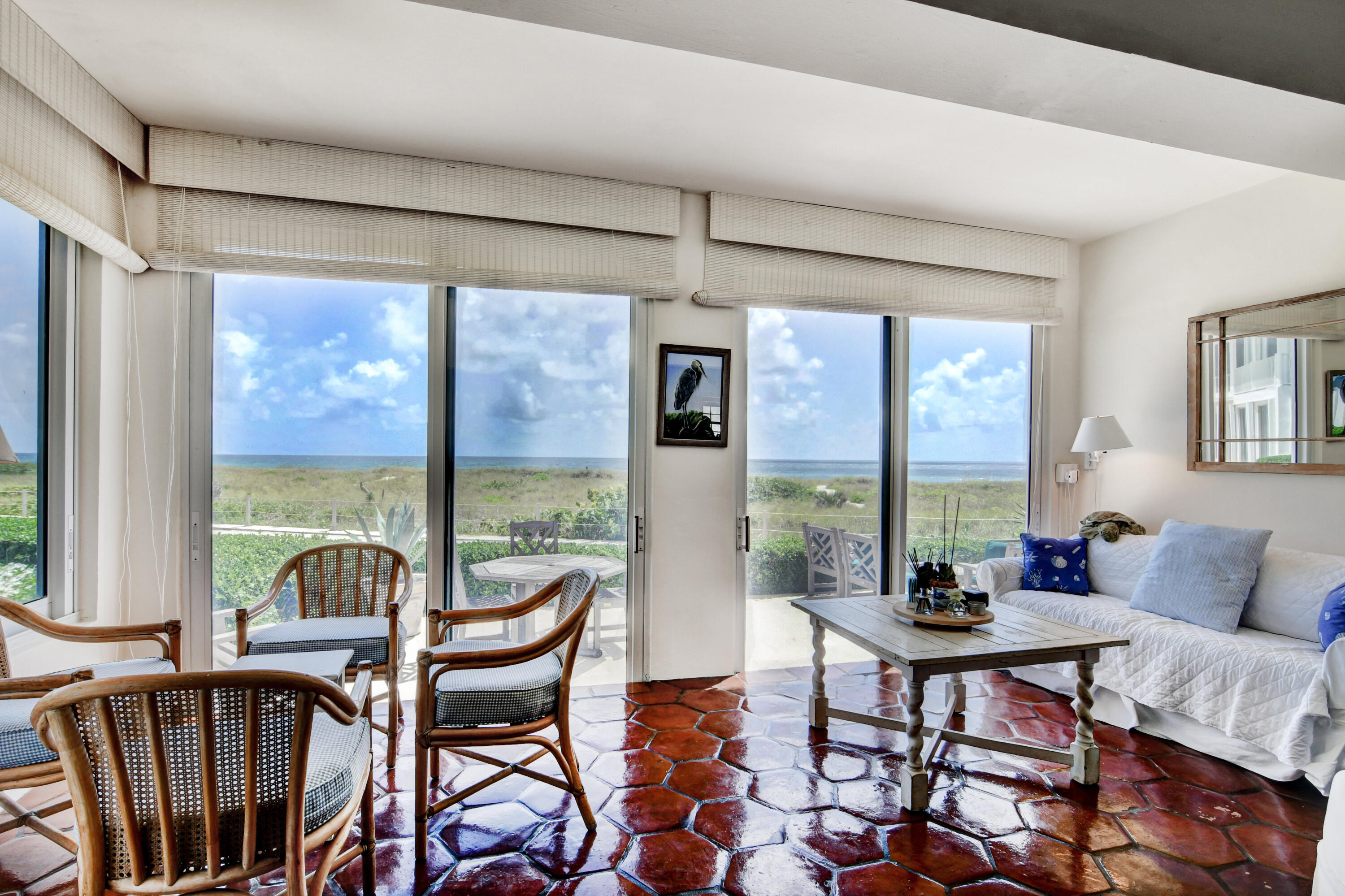 801 North Ocean Boulevard Delray Beach, FL 33483 - Photo 14 of 37 a living room with furniture and a large window