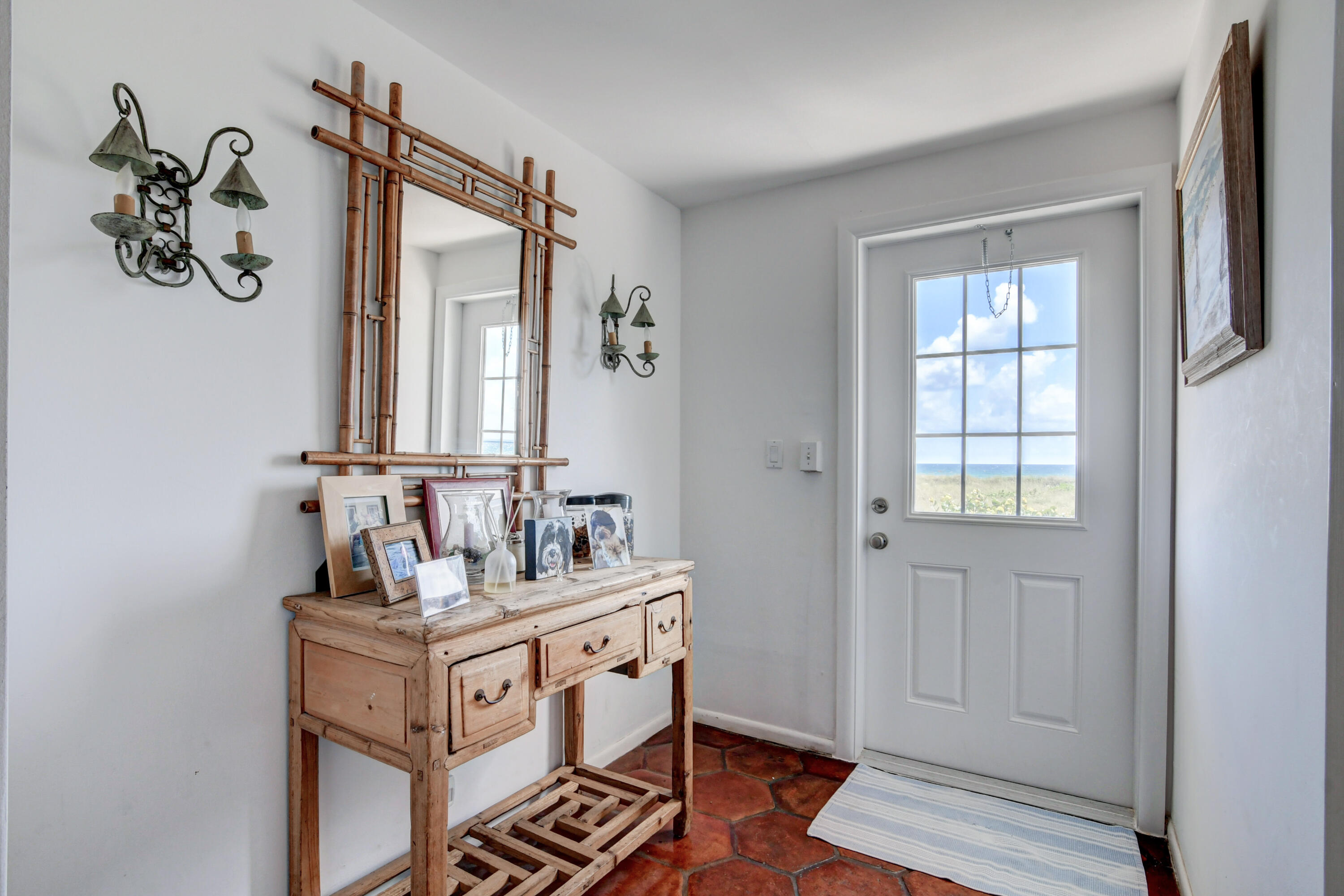 801 North Ocean Boulevard Delray Beach, FL 33483 - Photo 15 of 37 a bathroom with a sink and a mirror