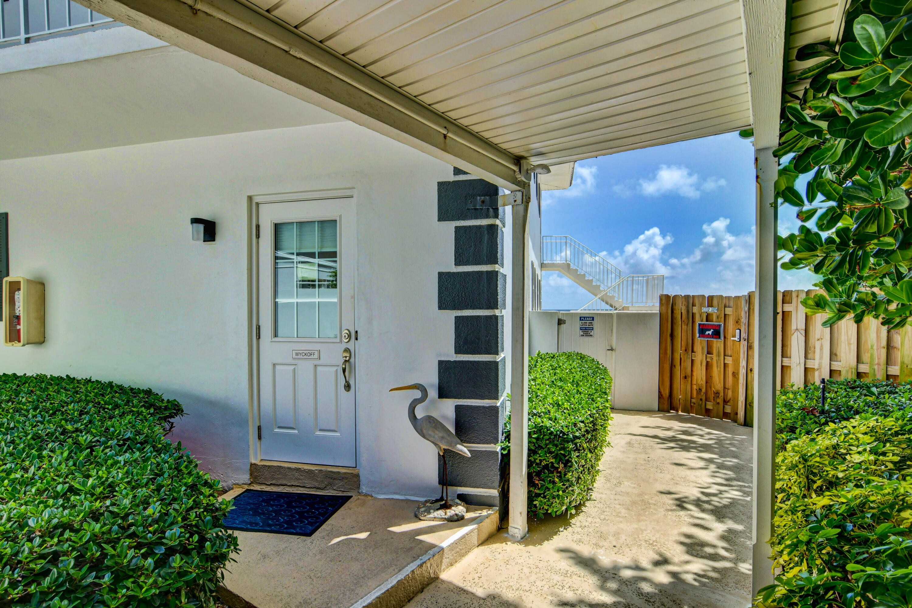 801 North Ocean Boulevard Delray Beach, FL 33483 - Photo 28 of 37 a front view of a house with garden